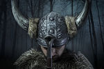 Peace, Viking warrior, male dressed in Barbarian style with swor